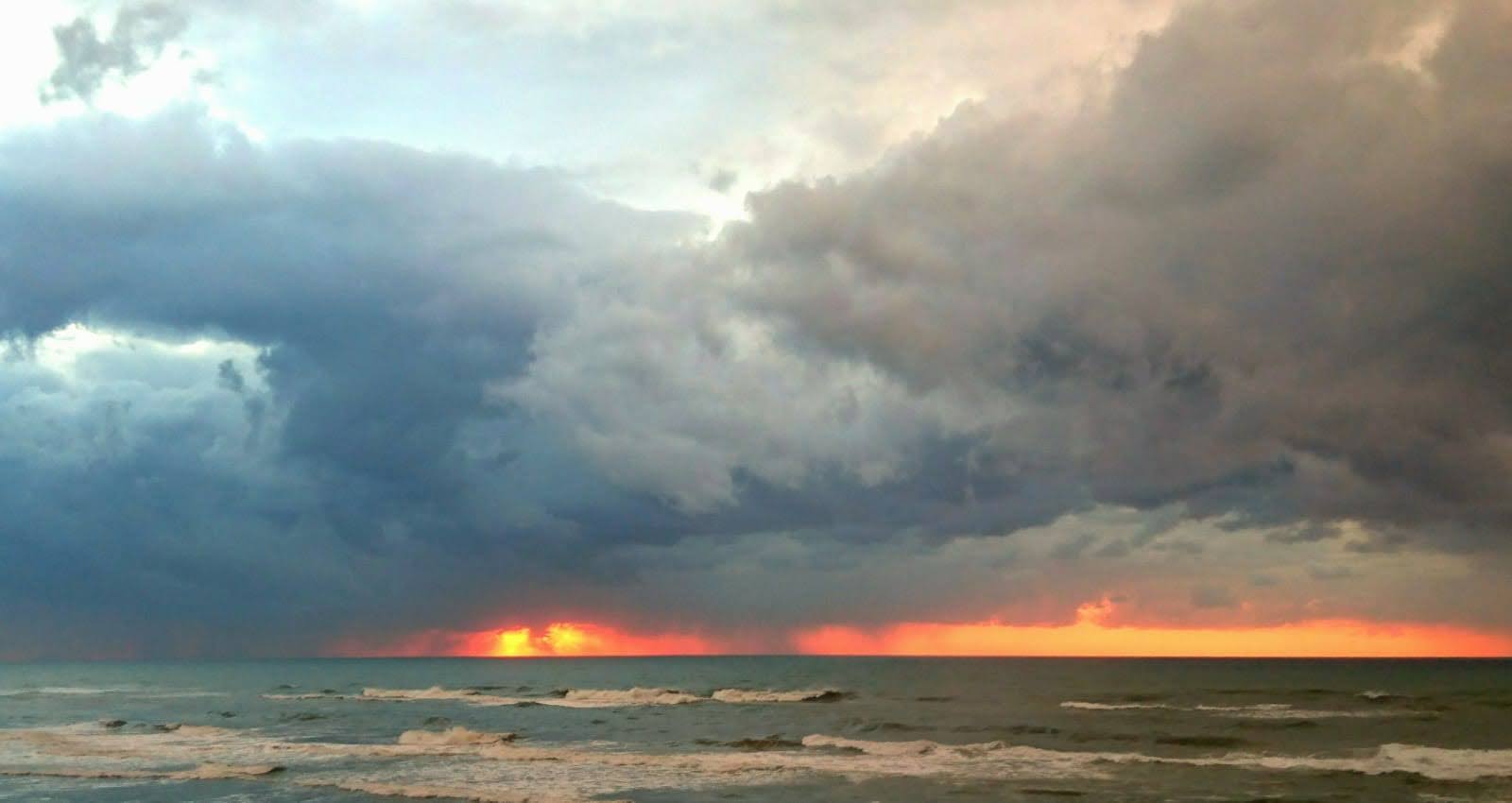 kitesurfing weather guide showing dark clouds building over kite spot