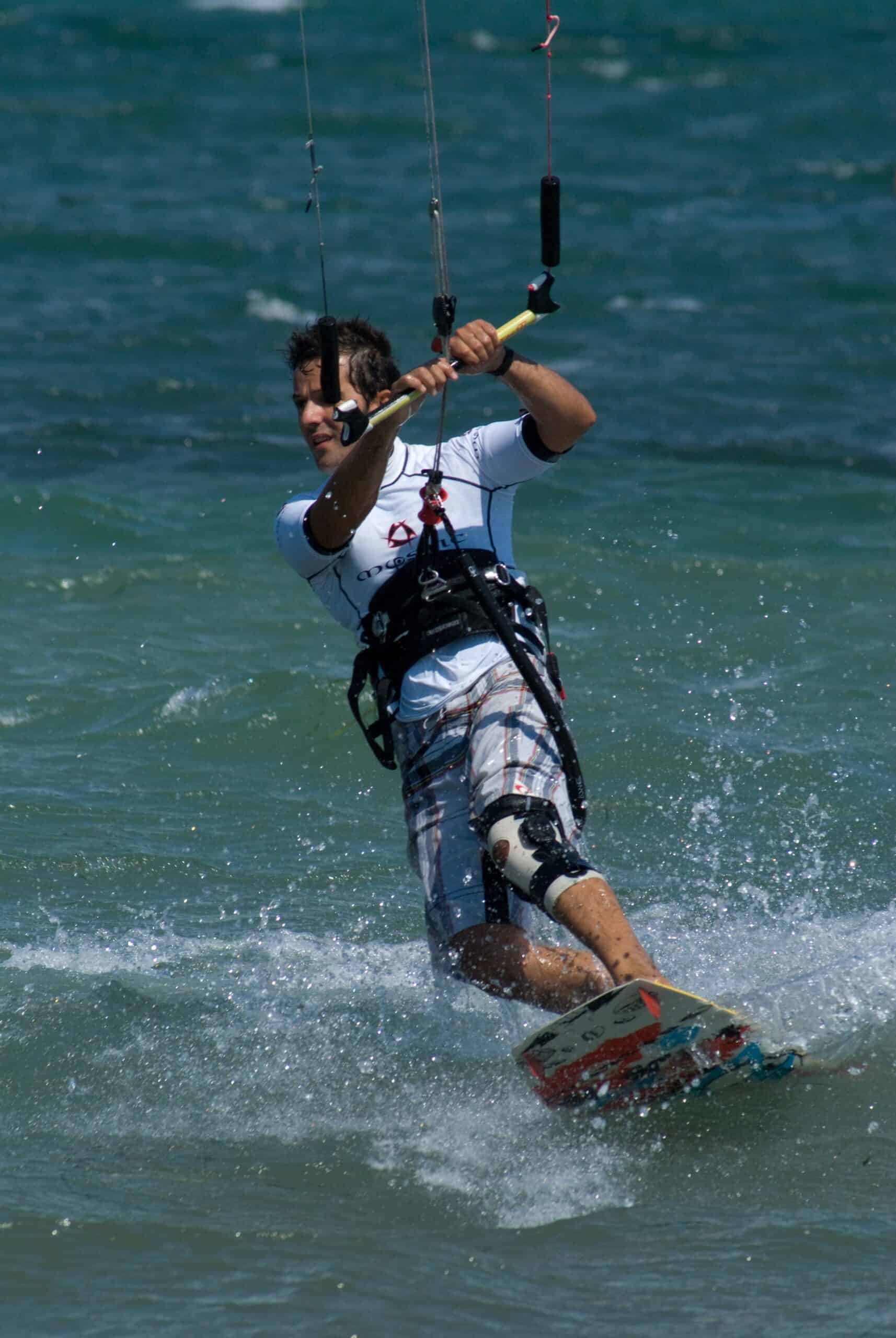 kitesurfing bad knees showing rider on water wearing neoprene knee support